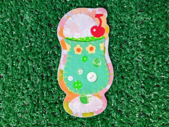 march 2026 "embroidered snacks" die cut sticker