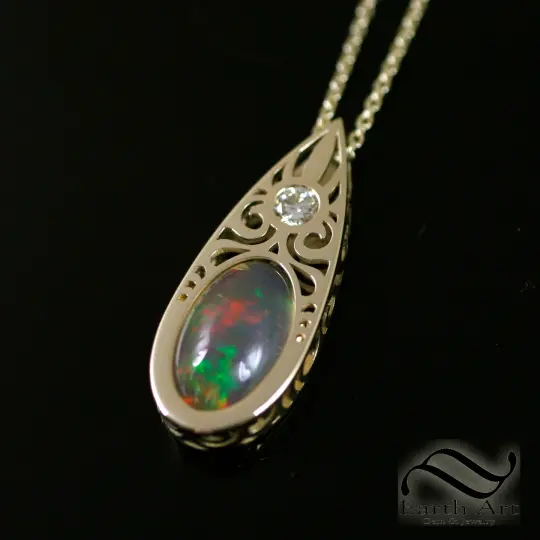 Art Deco Opal and Diamond pendant in 14k yellow gold