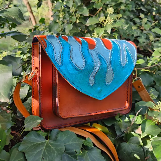 Handmade leather bag with metallic flames