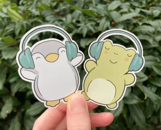 Frog and penguin with headphones stickers