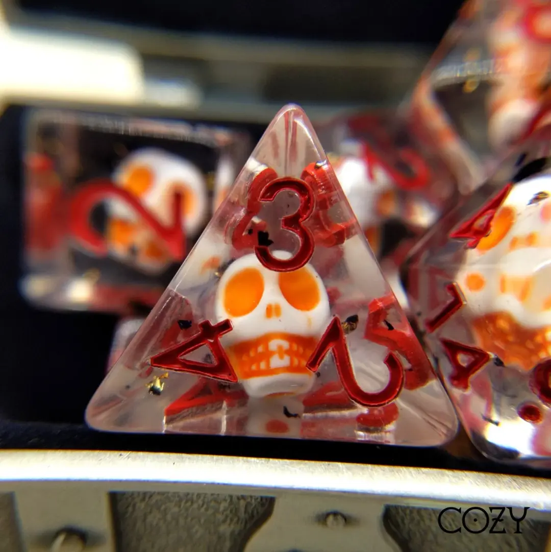 Haunted Skull Dice Set – 7-Piece White Skull Orange Black Glitter Red Font DnD
