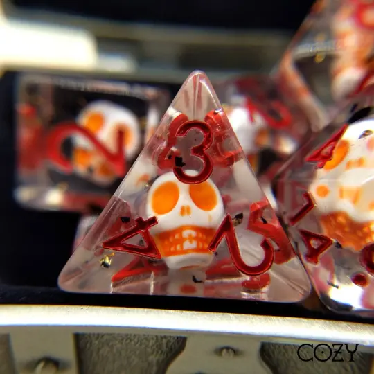Haunted Skull Dice Set – 7-Piece White Skull Orange Black Glitter Red Font DnD