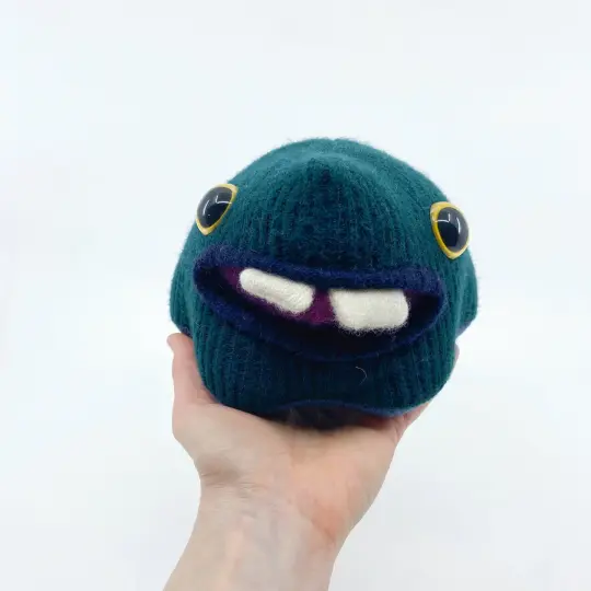 Brock the friendly monster plushie with two teeth