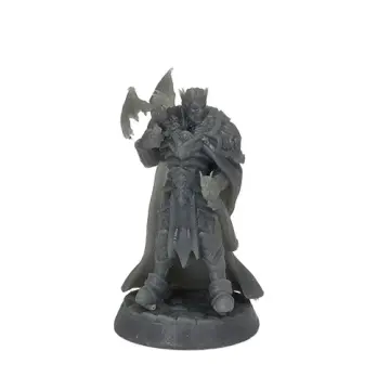 An unpainted grey resin miniature of a fantasy king standing against a white background. The figure is clad in heavy, ornate armor and a crown, wearing a long flowing cape, with a small winged dragon perched on his right forearm. He is mounted on a textured cobblestone base.