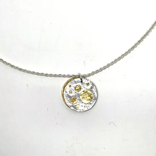 Silver and Brass Pierced Disc Necklace