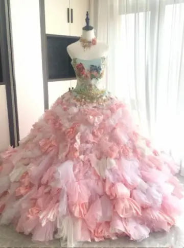 Sexy pink tulle ball gown with a fitted waist, strapless neckline, and elaborate tulle skirt R6482