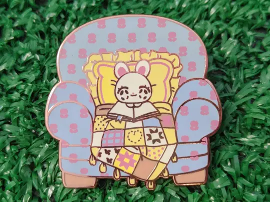 cozy bunny couch enamel pin