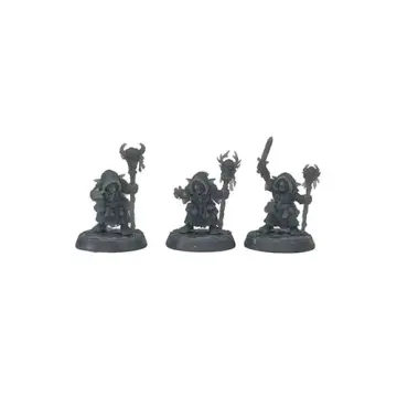 A front-view photograph of three unpainted grey resin goblin shaman miniatures against a white background. The figures wear heavily draped, hooded robes adorned with pouches. They wield various magical staffs topped with a horned skull, an antlered skull, and a spherical totem, with one raising a short sword. They stand on circular cobblestone-textured bases.