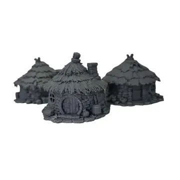 A photograph of three unpainted dark grey PLA goblin hut terrain pieces against a white background. The rustic huts feature circular cobblestone-textured walls, small arched wooden doors, round windows, and thick thatched roofs. Small details like wooden barrels and sacks are scattered around the exterior bases of the structures.
