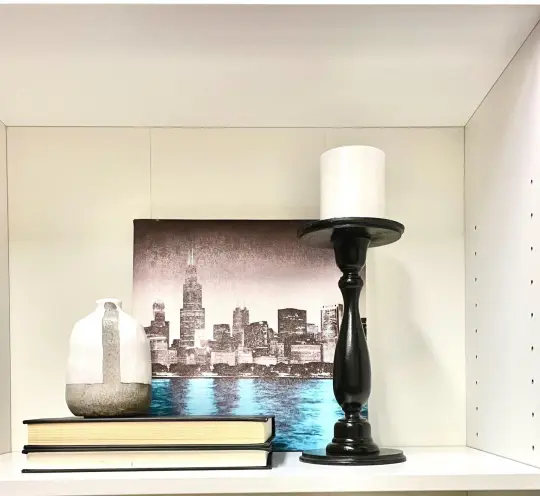 City Lights Art Set- Chicago Skyline canvas art, ceramic grey pot, black wood candle holder and books.