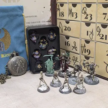 Undead dice advent calendar March of the Undead theme with painted skeleton, lich and spectre miniatures beside a purple sharp edge dice set