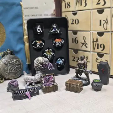 Dungeon dice advent calendar Storm the Dungeon theme with painted mimic, carrion crawler and barbarian miniatures beside a sharp edge dice set