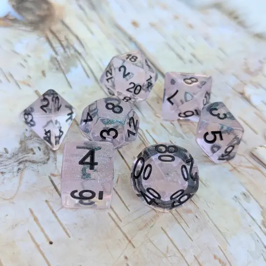 Pink Stardust Dice Set – 7-Piece Clear Pink Iridescent Glitter Black Font DnD