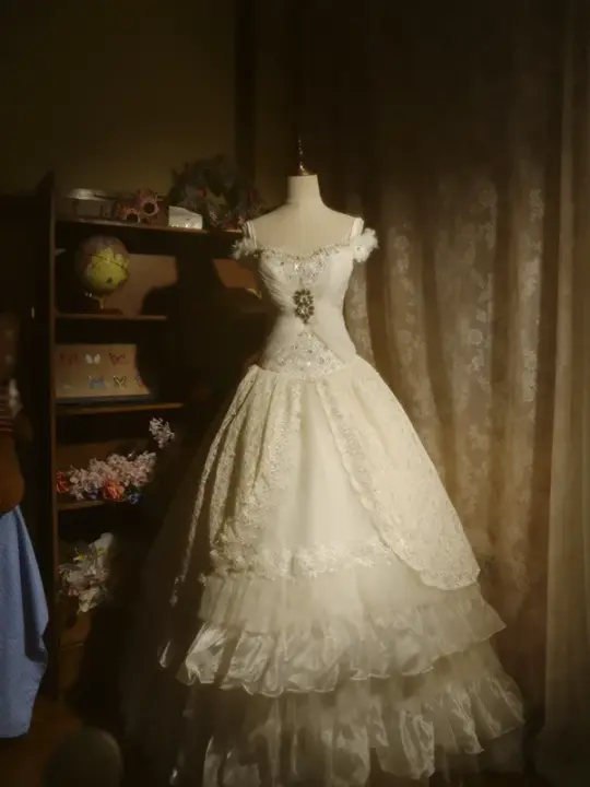 White off-the-shoulder floor-length ball gown with a cinched waist, slim fit and voluminous puffy skirt; bridal gown R7293