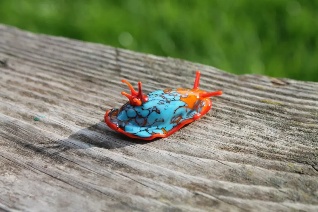 Bright Turquoise And Orange Glass Sea Slug Figure