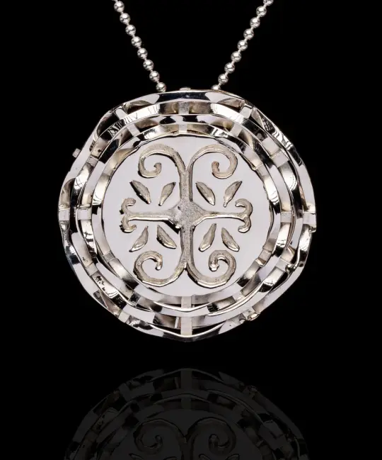 Wolastokiyik skicinuwihq,  people of the beautiful river, basket weave pendant