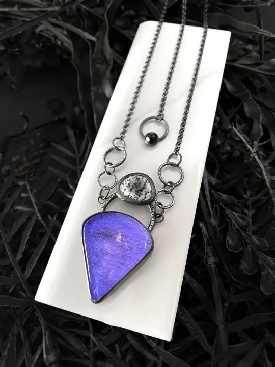 Rutilated Quartz Amulet with Purple Glow