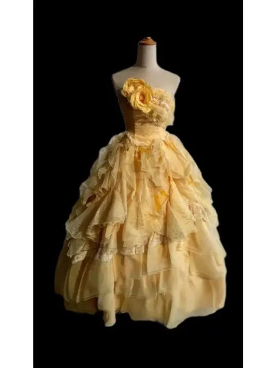 Light orange strapless ball gown with a cinched waist and a voluminous tiered cake skirt; bridal gown R7302
