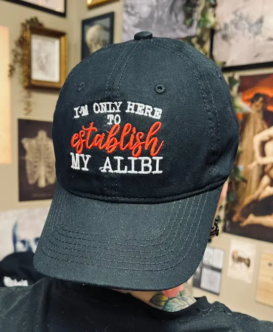I'm Only Here To Establish My Alibi Embroidered Dad Hat