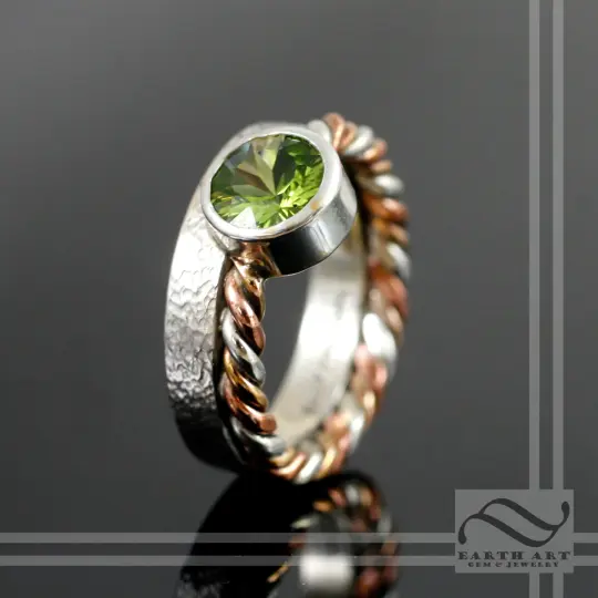 Peridot in Sterling Silver bezel ring with tri metal twist