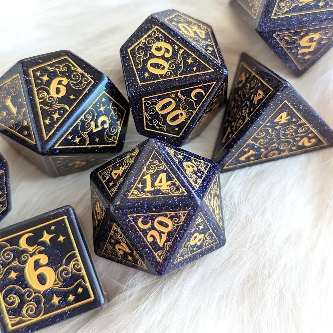 Dreamy Blue Goldstone with Gold Dice Set – 7-Piece Gemstone DnD Dice with Gold Celestial Symbols | Fennek & Finch