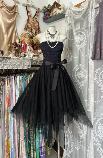 Black strapless, fitted waist, short ball gown with an asymmetrical hem R7483