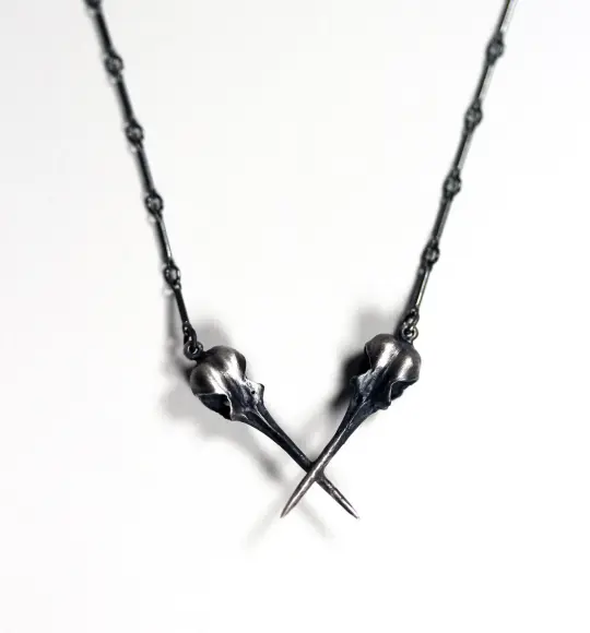 The AfterLife Part II. Crossed sterling hummingbird skulls.