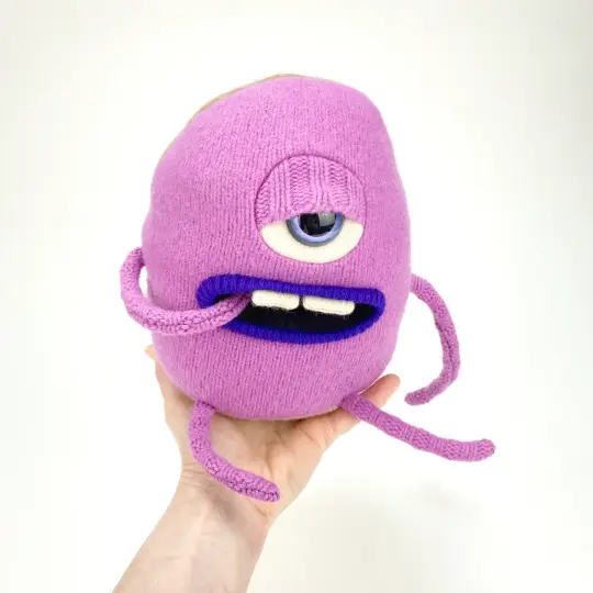 Snix the handmade plush sweater monster