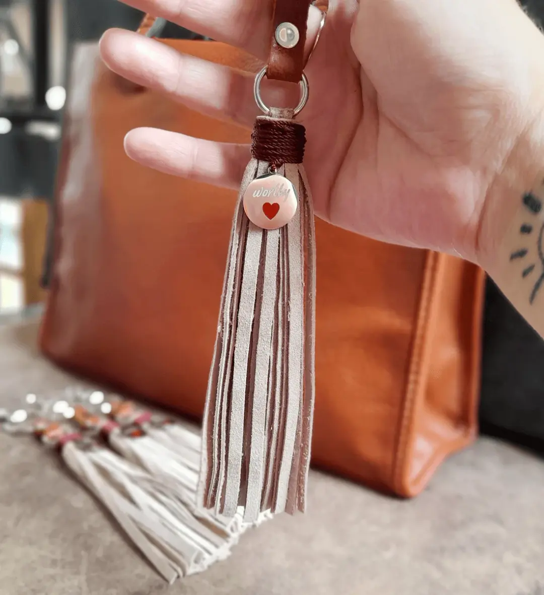 Worthy Spirit | Beige Leather Tassel Bag Charm with Silver Pendant