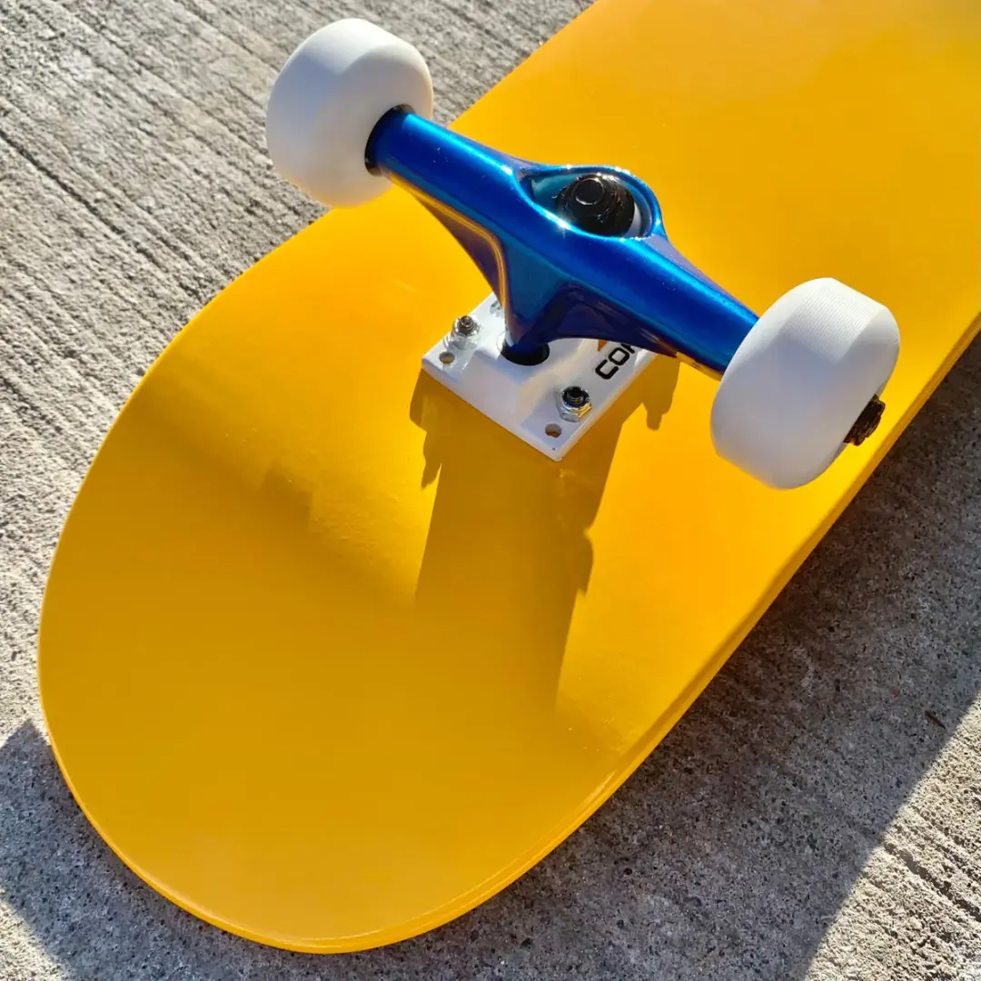 Yellow Complete Skateboard w/ Metallic Blue Trucks