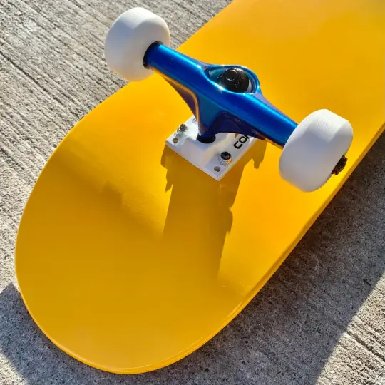 Yellow Complete Skateboard w/ Metallic Blue Trucks