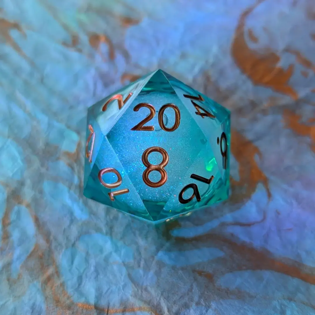 Ocean's Heart Liquid Core D20 – 1.5" Deep Blue Green Swirling Shimmer Die