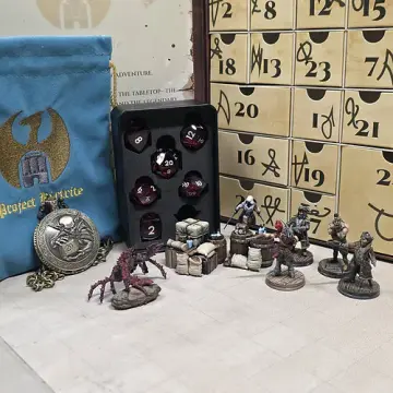 Pirate dice advent calendar Yo-Ho and Plunder theme with painted pirate crew, giant crab and cargo miniatures beside a red sharp edge dice set