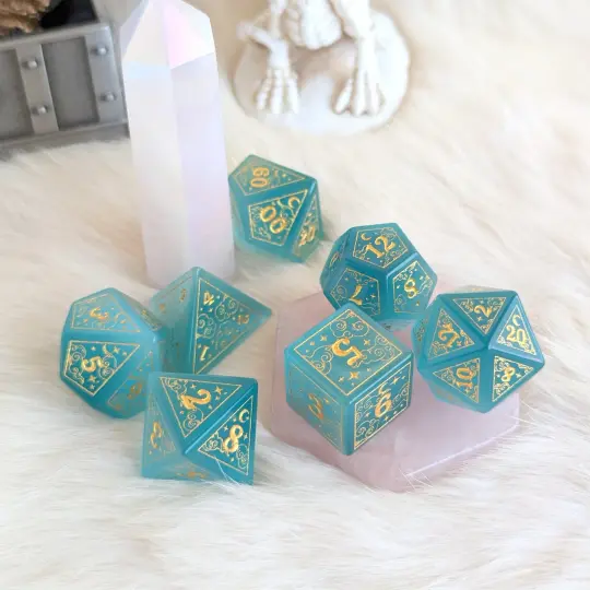 Dreamy Blue Cat's Eye Glass Dice Set – 7-Piece Celestial DnD Dice with Gold Symbols | Fennek & Finch