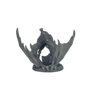 A photograph of a second unpainted, 3D-printed grey resin shrieker miniature. This figure is posed crouching lower, leaning forward menacingly over a piece of ruined stone masonry on its base, supporting its weight on its large, winged forelimbs.
