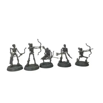 A front-view photograph of five unpainted grey resin skeleton archer miniatures against a white background. The skeletal figures are posed dynamically, drawing their bows and aiming arrows, standing on circular, cobblestone-textured bases. Some wear tattered remnants of clothing or carry quivers.