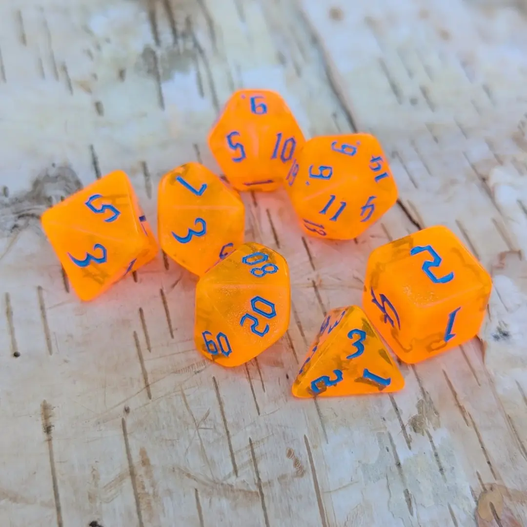 Pumpkin Orange Will O Wisp Dice Set – 7-Piece Glitter Blue Font TTRPG Dice