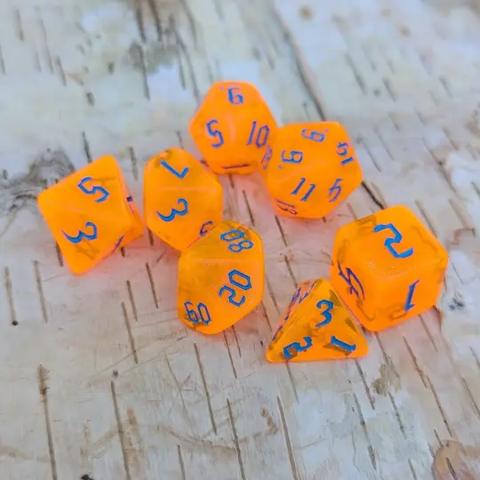 Pumpkin Orange Will O Wisp Dice Set – 7-Piece Glitter Blue Font TTRPG Dice