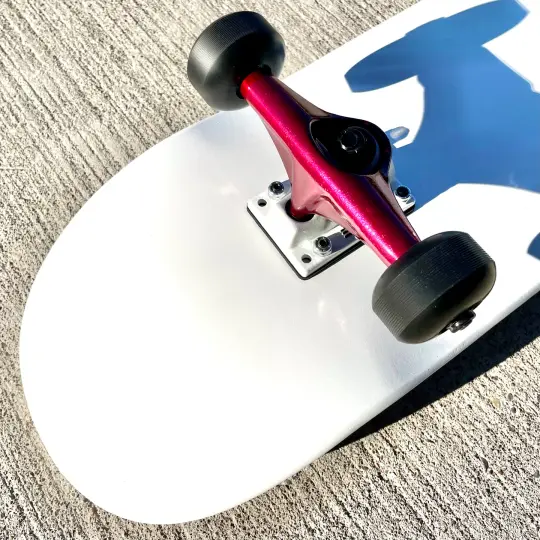 White Complete Skateboard w/ Metallic Red Trucks