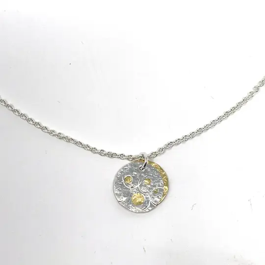 Silver and Brass Pierced Disc Necklace
