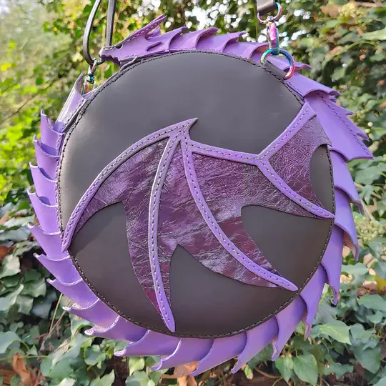 Round leather bag with dragon