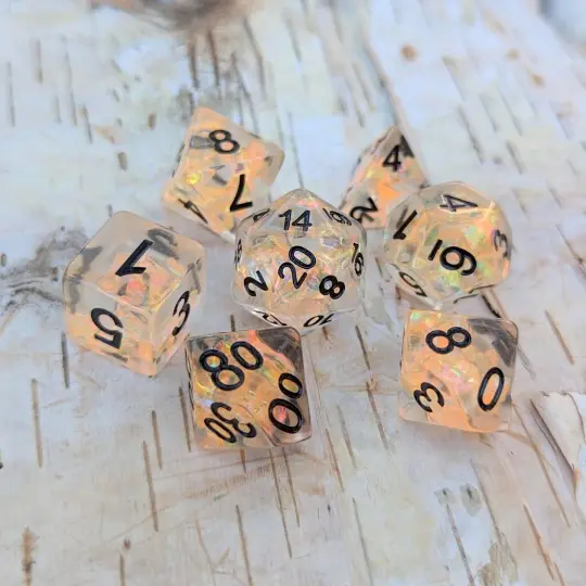 Phoenix's Rebirth Dice Set – 7-Piece Orange Iridescent Cellophane Black Font