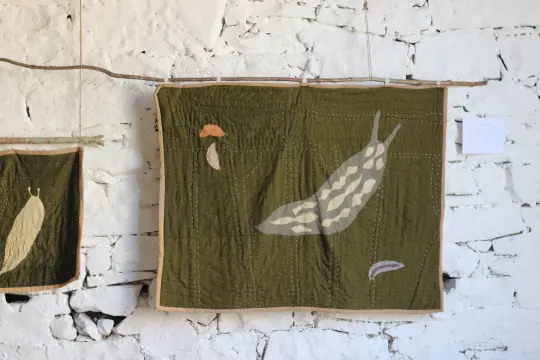 Green Cellar Slug and the Undesirables | quilted wall hanging